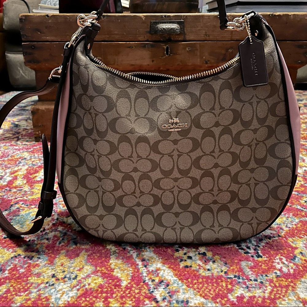 Never used 2020 coach bag with rose accents. Originally paid $475